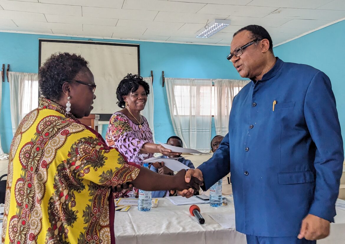SENAT National Secretary offering a certificate to a school proprietor AC