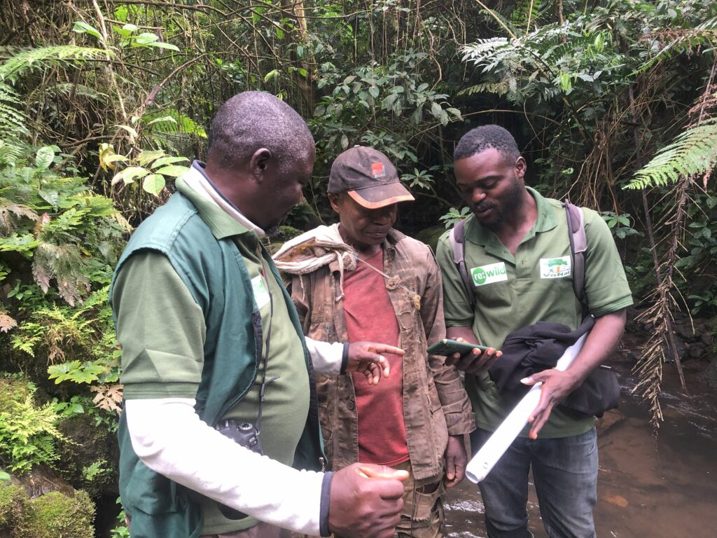 VoNat staff and community member recording Goliath Frog Ecological Threat in Mt. Nlonako area