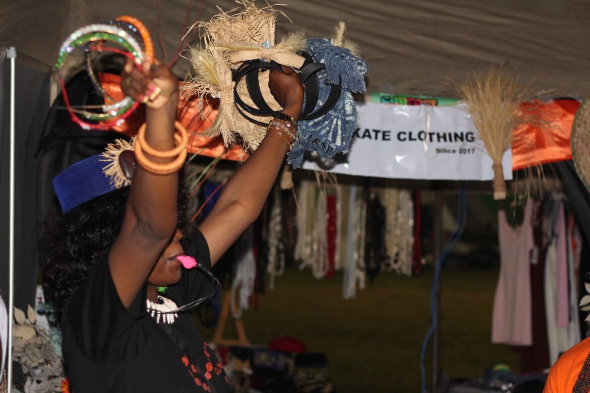 The founder of Delikate Clothing showcasing her hand made accessories to potential clients at CIMFEST 2025 (Image Boris-Kaloff Batata)